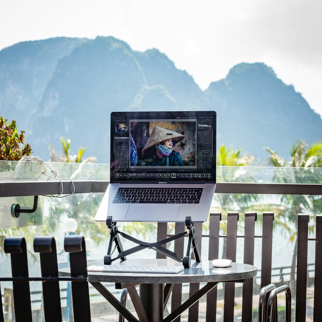 laptop on desk with a view for digital nomad
